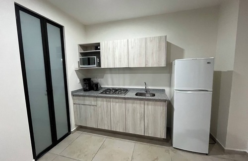 Zapopan Apartment | Apartment in Zapopan, Jalisco, with a view of the mountains and a pool