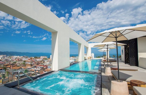 Colonia 5 de Diciembre Condo | Blissful Ocean-View Penthouse with Rooftop Pool