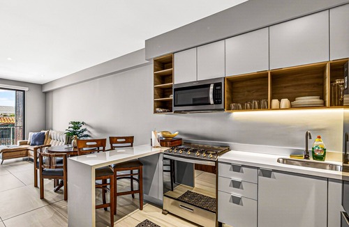 Fluvial Vallarta Condo | Modern condo with rooftop pool, balcony, gas grill & gym access