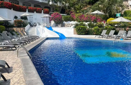 Peninsulas de Santiago House | Ocean view, pools, restaurant, beach access