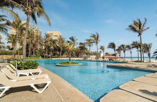 Playa Diamante Apartment | Oceanfront condo with a pool, hot tub, and spectacular view