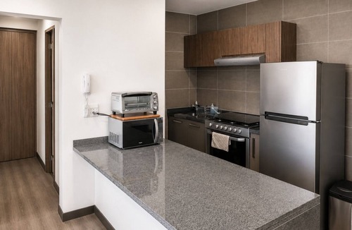 Anahuac Apartment | Stunning Hi-Rise high speed WiFi , minimalist chic decor, with all the amenities