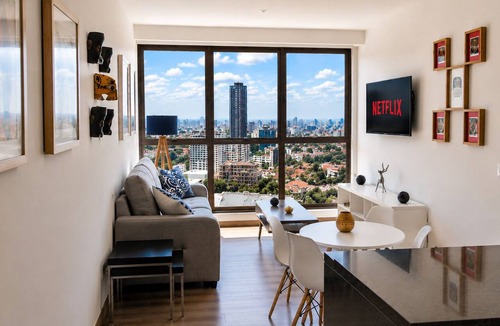 Anahuac Apartment | Stunning Hi-Rise high speed WiFi , minimalist chic decor, with all the amenities