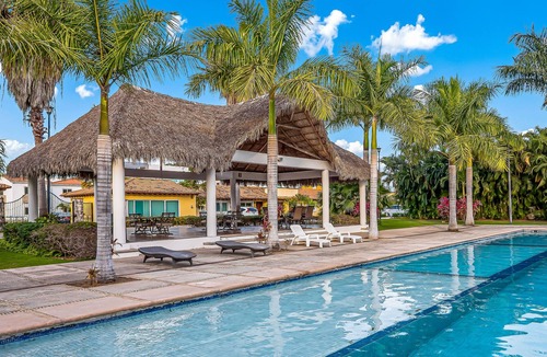 Flamingos House | Vibrant coastal home with private plunge pool & patio + resort pool access
