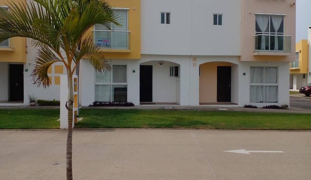 A home with a family-friendly atmosphere, close to the beach, shops, and the airport.