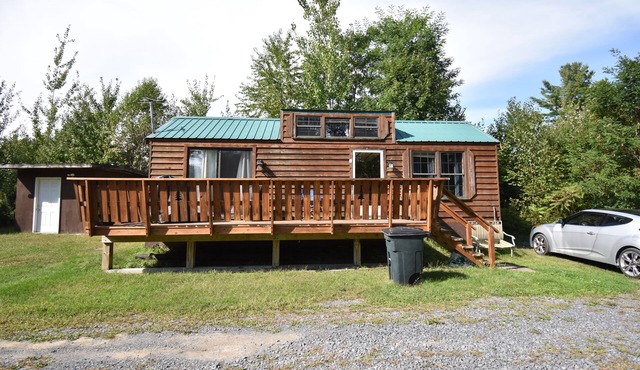 Rustic, cozy lodge available for rent at Plattsburgh RV Park in Plattsburgh