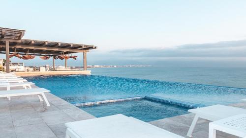 Bucerias Apartment | Panarea Beachfront Living - Pools Spa Gym & Luxury Amenities